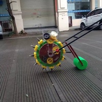 Semoir automatique à poussée manuelle pour l'agriculture Petits semoirs propulsés pour cacahuètes, maïs, soja et riz