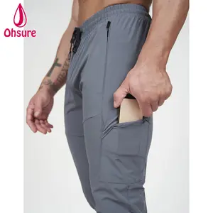 Hot Selling Custom Logo Tapered Fit Zipper Pockets Hidden Side Pockets Men Fitness Gym Workout Warm-up Track Pants Sweatpants