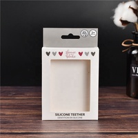 Vente en gros de hochets pour bébés personnalisés avec logo, anneaux de dentition en silicone et boîtes d'emballage en papier pour attaches-tétines