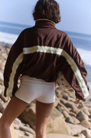 Veste de sport pour femme avec logo personnalisé OEM, légère, coupe-vent, avec bordure blanche, pour la course à pied, vente en gros