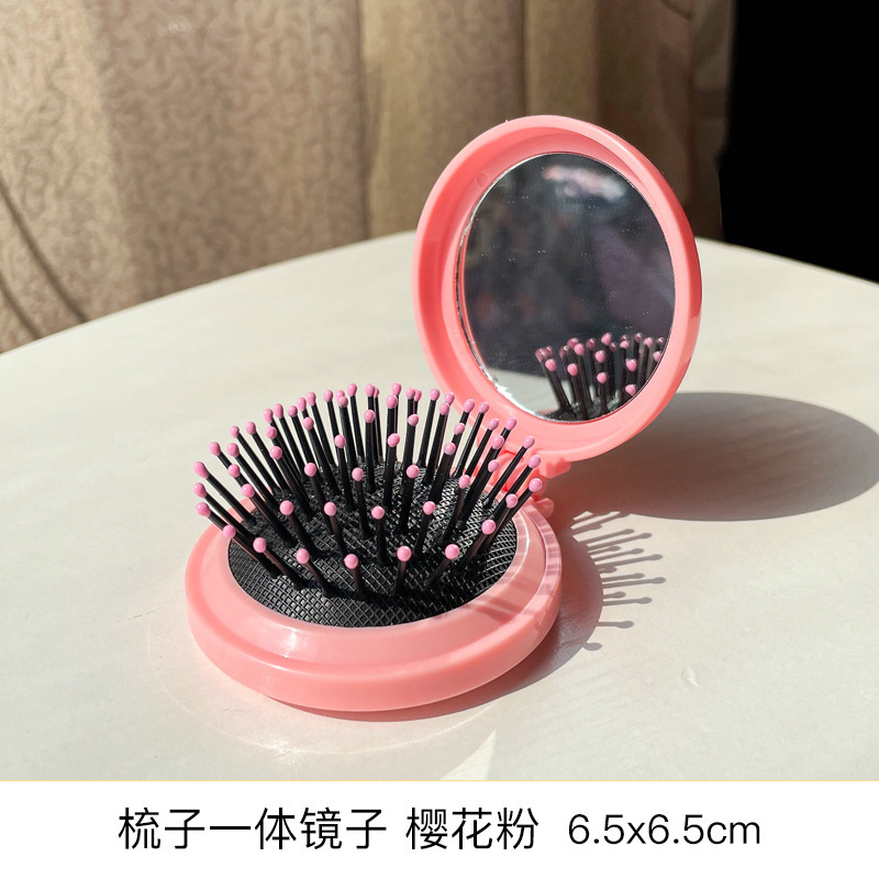 Peigne miroir intégré poudre de cerise