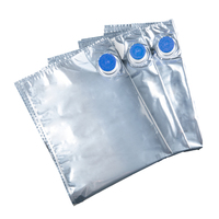 Sac de bavoir jetable portable en papier d'aluminium personnalisé dans une boîte en carton avec distributeur, emballé avec une valve, pour liquides.
