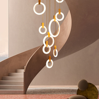 Lustre suspendu moderne créatif pour escalier et salon, design long et rotatif, style duplex