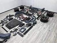 Kit carrosserie aérodynamique complet en fibre de carbone pour Mercedes G63 W464 SUV tout-terrain, comprenant des ailes larges, un capot BRABUS et un diffuseur arrière.