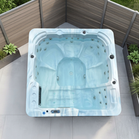 Baignoire carrée moderne avec hydromassage, jets d'air et cascade de chromothérapie LED