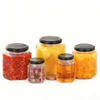 45ml 60ml 85ml 100ml 180ml 280ml 380ml 500ml 730ml Kemasan Kaca Madu Selai Makanan Stoples Kaca Heksagonal dengan Tutup
