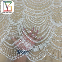 Tissu de robe de mariée africaine haut de gamme en dentelle perlée blanche française avec des paillettes