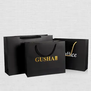 Embalaje de joyería de Boutique, bolsa de papel negra de borde dorado de lujo de alta calidad con Logo impreso personalizado, venta al por mayor