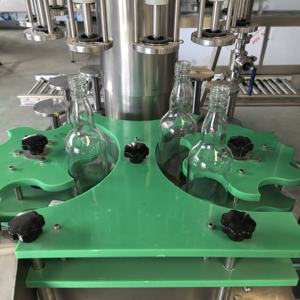 เครื่องบรรจุของเหลวแบบสุญญากาศสำหรับขวดแก้ว น้ำ เครื่องดื่มแอลกอฮอล์ น้ำมันหอมระเหย ไวน์ <span class=keywords><strong>น้ำส้มสายชู</strong></span> พร้อมสายพานลำเลียง - Product Image 4