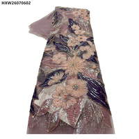 Magnifique tissu en dentelle de tulle brodé de fleurs, orné de perles et de sequins, idéal pour les robes de soirée