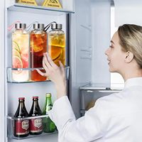 Vente en gros de bouteilles d'eau réutilisables 1L personnalisées mignonnes isolées en verre borilicate transparent pour sports de gymnastique avec manchon en néoprène
