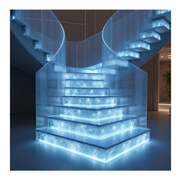 Escalier incurvé décoratif moderne avec marches en pierre artificielle pour appartement