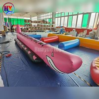 Bateau gonflable de type requin à 8 places en PVC robuste, à tube unique, avec logo et couleur personnalisés, pour activités de groupe en parc aquatique.