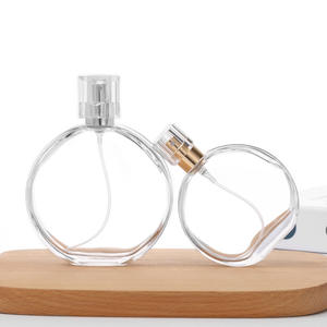 Flacon pulvérisateur de parfum en <span class=keywords><strong>verre</strong></span> rond de haute qualité, rechargeable, pour cosmétiques et soins de la peau, 30 ml, 50 ml, 100 ml, avec bouchon - Product Image 1