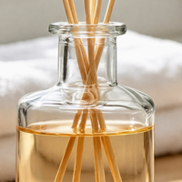 Flacon diffuseur en verre cylindrique transparent de luxe personnalisé avec bouchon à vis pour l'emballage de parfums d'intérieur