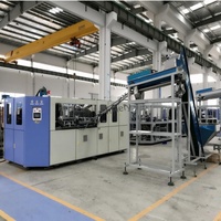 Machine de soufflage automatique de bouteilles PET à col étroit, avec moteur et conception à large ouverture, contrôlée par PLC, pour la fabrication de bouteilles d'eau