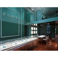 Vitrine murale à LED rétroéclairée avec motif géométrique moderne en forme de diamant et dessus en verre pour boutique