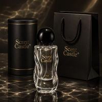 Flacon de parfum rond de luxe de 40 ml, nouveau design, emballage en verre avec pompe à pression et bouchon rond.
