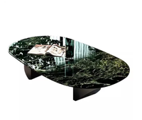 Table basse ovale minimaliste en marbre italien pur, légère et luxueuse, pour salon moderne et élégant.