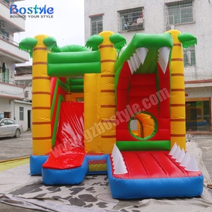 Parc d'attractions gonflable multifonctionnel personnalisé en PVC, thème dinosaures tropicaux, avec parcours d'obstacles et toboggan, facile à monter - Product Image 1