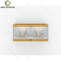 Meubles de magasin de bijoux haut de gamme personnalisés, vitrine d'exposition avec éclairage LED, armoire murale en verre trempé, présentoir suspendu pour boutique