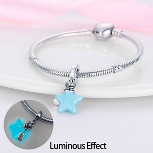 This white brass <b>bracelet</b> features enamel <b>flowers</b> and stars, glows in the dark, and its cute style makes it a perfect gift - Product Image 4