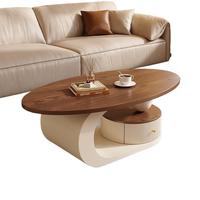 Ensemble de table basse ovale en noyer clair de style crème moderne et luxueux, adapté aux petits salons avec base noire