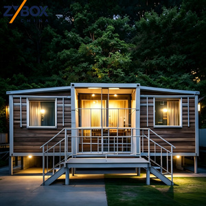 <span class=keywords><strong>Maison</strong></span> conteneur modulaire préfabriquée extensible surélevée de 40 pieds, finition <span class=keywords><strong>bois</strong></span> foncé, pour villa forestière, complexe hôtelier et glamping - Product Image 1