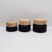 Pot cosmétique de haute qualité 100g en verre noir mat à épaule inclinée avec couvercle en bambou pour crème