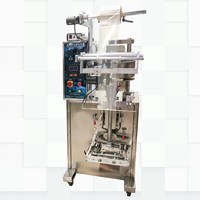 Machine d'emballage VFFS pour pistaches, noix de cajou, amandes, noix et pecans, avec remplissage volumétrique par godet et codage de date