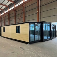 Maison conteneur pliable et extensible de style artisanal personnalisé avec panneaux métalliques sculptés pour usage agricole et résidentiel