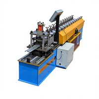 Machine de formage de rouleaux pour portes à enroulement de type lamelles métalliques, équipement de fabrication de portes à enroulement, production industrielle