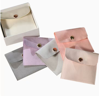 Pochette de luxe haut de gamme Jinsky en microfibre avec fermeture à pression et cordon de serrage, motif cœur estampé à chaud, pour ranger colliers et boucles d'oreilles