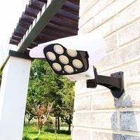 Caméra de surveillance de simulation Lampe murale à induction solaire LED Lumière forte Lampe de rue anti-voleur Télécommande Lampe de surveillance