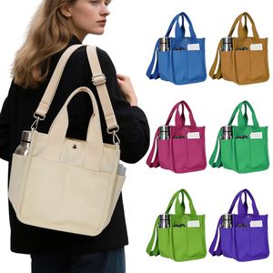 Sac fourre-tout en toile beige avec poches latérales pour bouteille d'eau et bouton-pression pour le bureau, les pique-niques et le transport de repas bento - Product Image 4