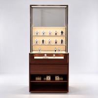 Vitrine d'exposition de montres avec cadre doré, éclairage LED, supports en acrylique, tiroirs et étagère ouverte, certifiée CE ETL, pour les boutiques de montres
