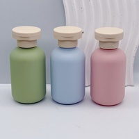 Flacons cosmétiques ronds en plastique givré de 100 ml avec bouchon à clapet pour lotion