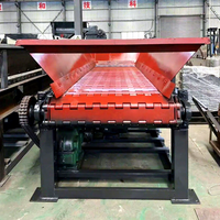 Plaque d'alimentation pour machines de manutention de matériaux en vrac