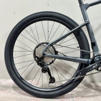 Vélo de montagne Kozo en fibre de carbone 29 pouces, frein à disque hydraulique à quatre pistons, jante en aluminium, cadre à suspension souple 12 vitesses, haute vitesse pour adultes