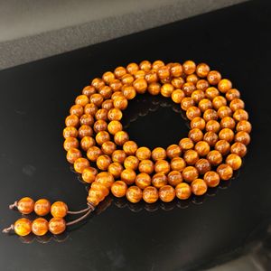 สร้อยข้อมือลูกประคำเรซิ่นลายไม้สีแดงทอง HS142 วินเทจ บลัดลิว วิลโลว์  นำโชค เสริมทรัพย์ สำหรับผู้ชาย  ประดับลูกประคำพระพุทธ - Product Image 6