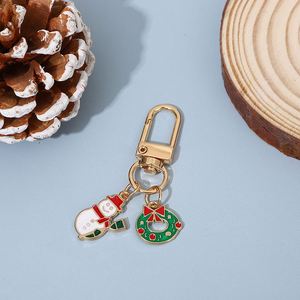 Porte-clés tendance en métal avec revêtement goutte à goutte, motif cerf de Noël et couronne, idéal pour téléphone, sac, pochette, cadeau - Product Image 1
