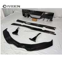 Kit carrosserie en fibre de carbone comprenant un spoiler avant, des jupes latérales et un diffuseur arrière, adaptés à la Chevrolet Corvette C7.