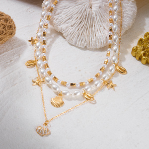 Nouveau collier bohème d'été plaqué or 18 carats multicouche avec pendentif étoile <span class=keywords><strong>de</strong></span> mer, coquillage et perle, chaîne perlée blanche, bijoux <span class=keywords><strong>de</strong></span> vacances pour femme - Product Image 4
