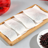 Thé de Roselle en fleurs entières en sachet visible, goût acidulé et fruité, infusion rubis intense, bien-être quotidien, étiquette personnalisée, directement de l'usine