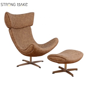 Metà del secolo schienale alto in pelle sintetica girevole funzione in fibra di vetro poltrona con pouf pouf - Product Image 1