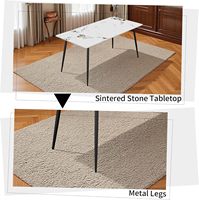 Table de cuisine minimaliste et moderne pour coin petit-déjeuner, salon ou salle à manger, avec base en acier et plateau en pierre frittée marbrée