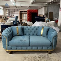Canapé Chesterfield Luxe de Style Américain Bleu en Velours avec Piétement Doré en Acier Inoxydable pour Salon