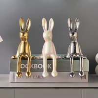 Figurine lapin assis en céramique peinte à la main en gros décor de noyau de chalet émaillé pour cadeau d'accent de pépinière de jardin de Pâques en vrac