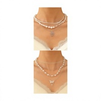 Collier pour femme de style européen et américain, en alliage, avec chaîne en bambou, fausses perles, pompon, cœur, croix, papillon, assorti à tout