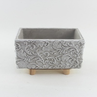 Nouveau pot de fleurs rectangulaire gris mat en ciment avec motif en relief et support